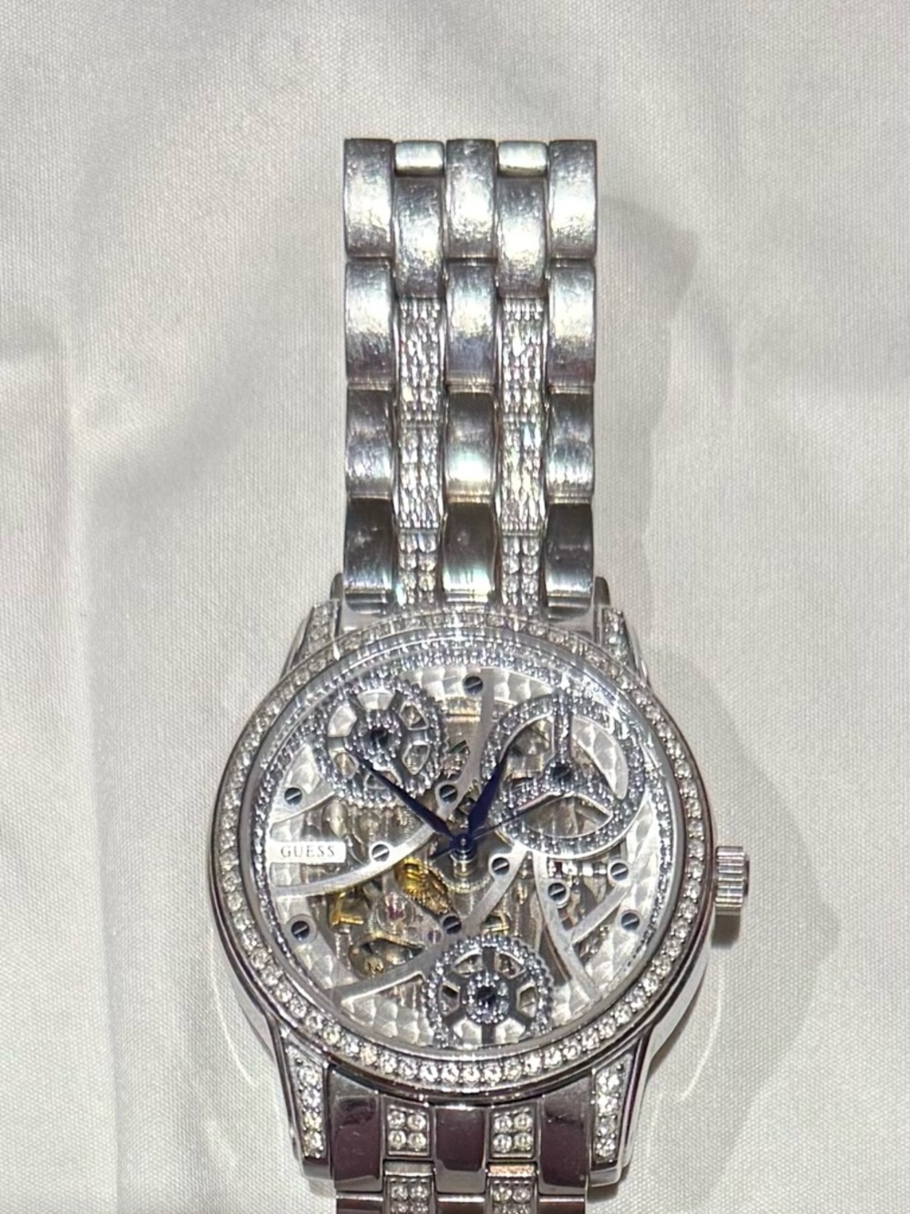 Guess Silver Tone Skeleton Watch with Blue Hands